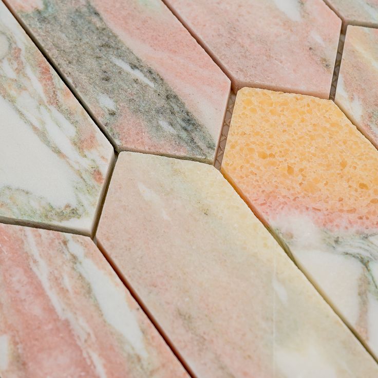 an orange and pink marble pattern on the floor