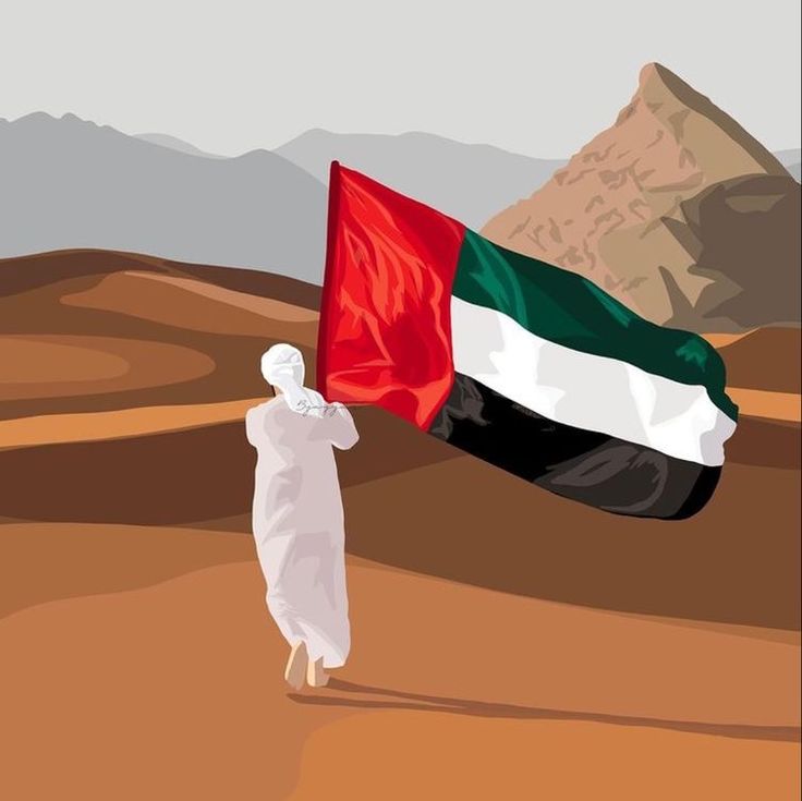 a man walking across a desert holding a flag