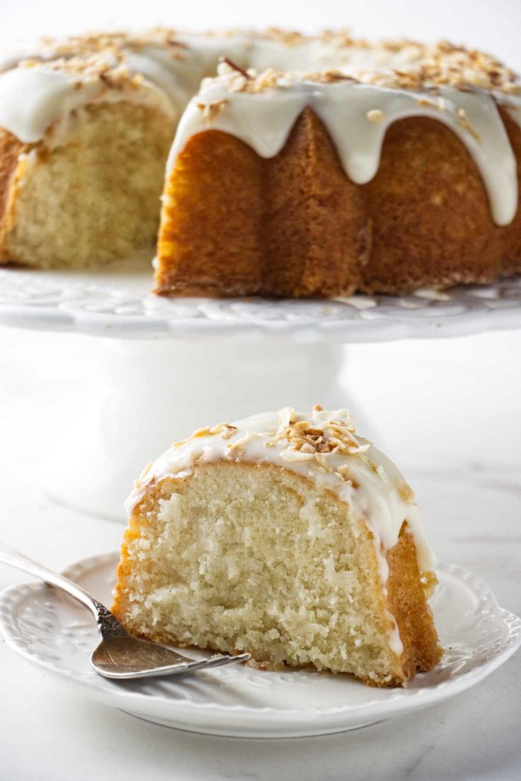 a bundt cake on a plate with a slice cut out and ready to be eaten