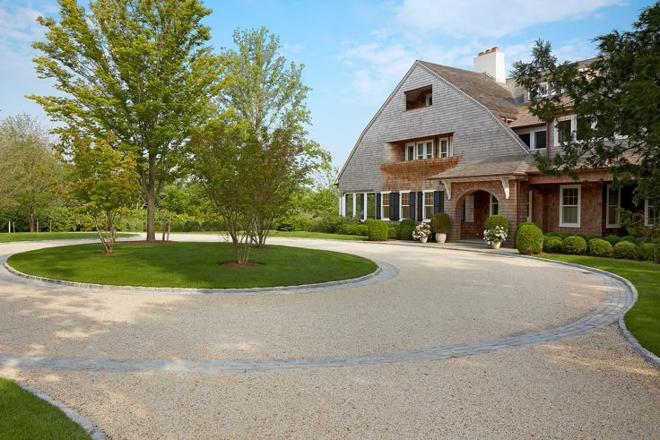 a large house with a driveway in front of it