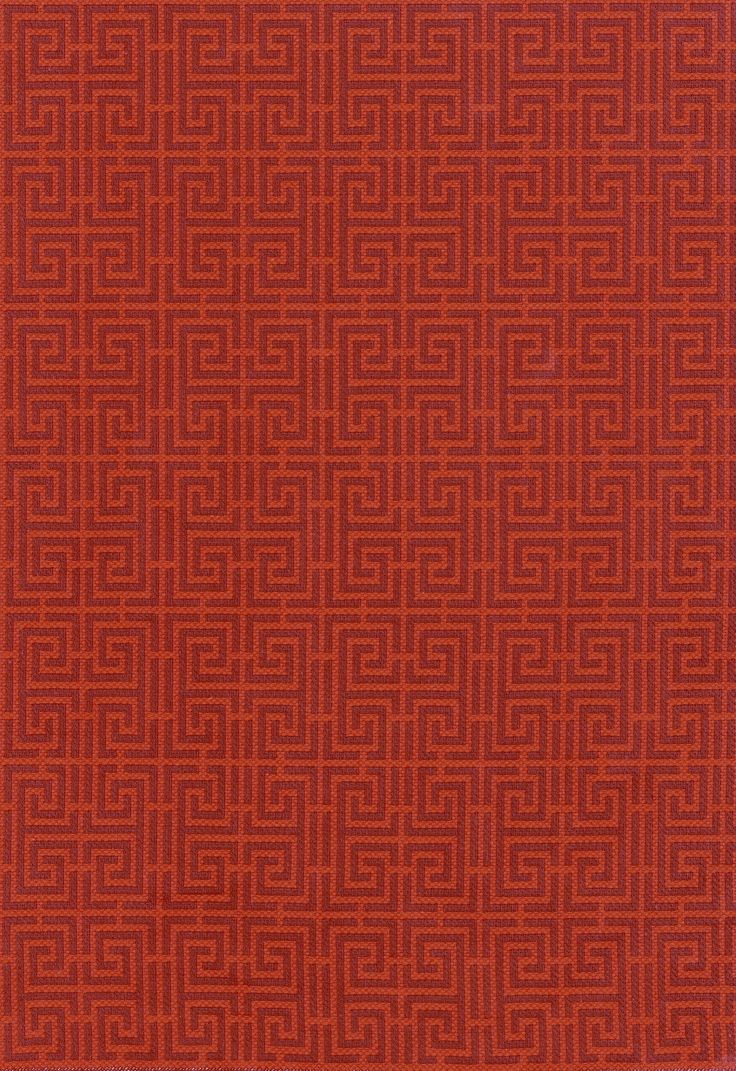 an orange and red rug with mazes on it