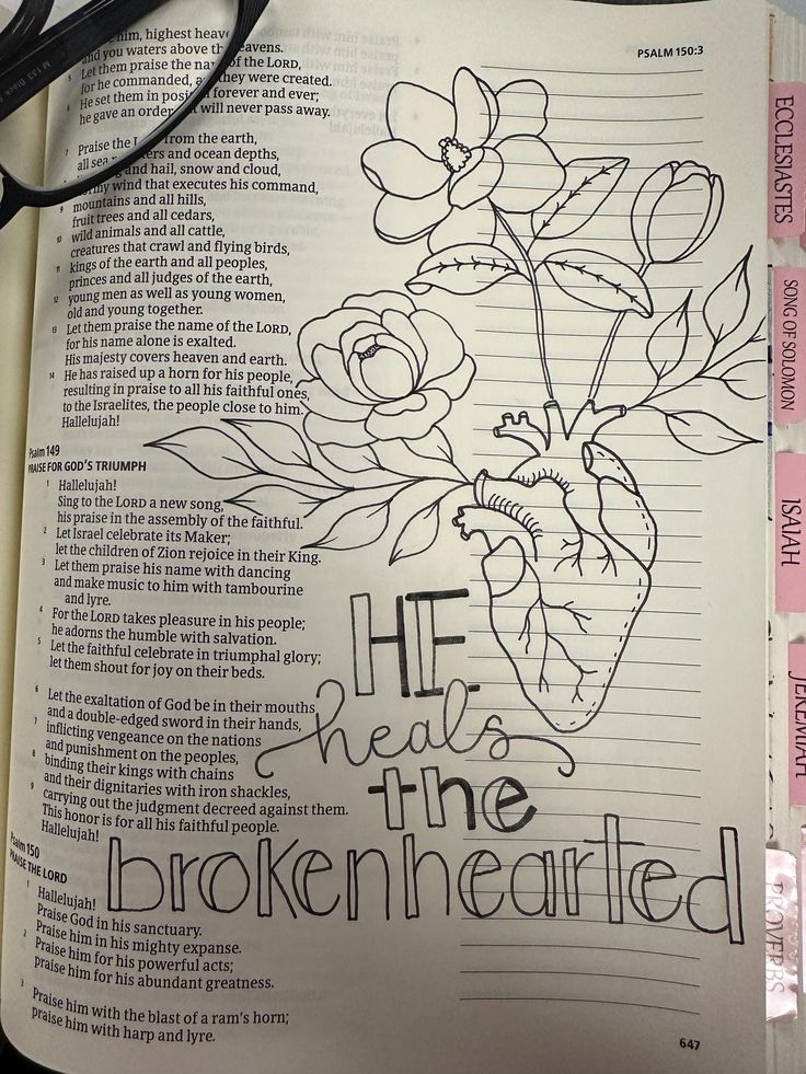 an open bible with flowers and the words he will be the brokenhearted on it