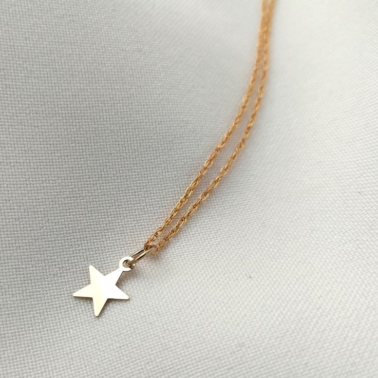 "The tiniest of gold star pendants adorns a dainty rope style chain to create this gold filled necklace. DIMENSIONS: Star pendant: 7mm / Chain length: 16\"/43cm length." Gold Star Pendant, Treasure Jewelry, Gold Filled Necklace, Celestial Necklace, Gemstone Studs, Rope Necklace, Gold Star, Star Pendant, Pretty Jewellery