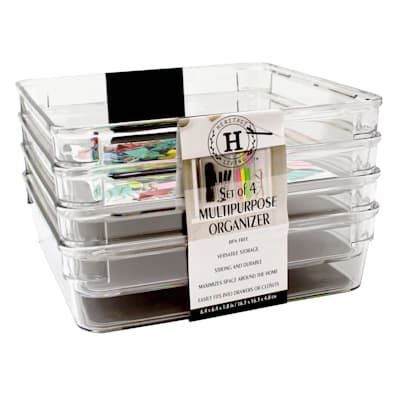 three clear storage containers with labels on them