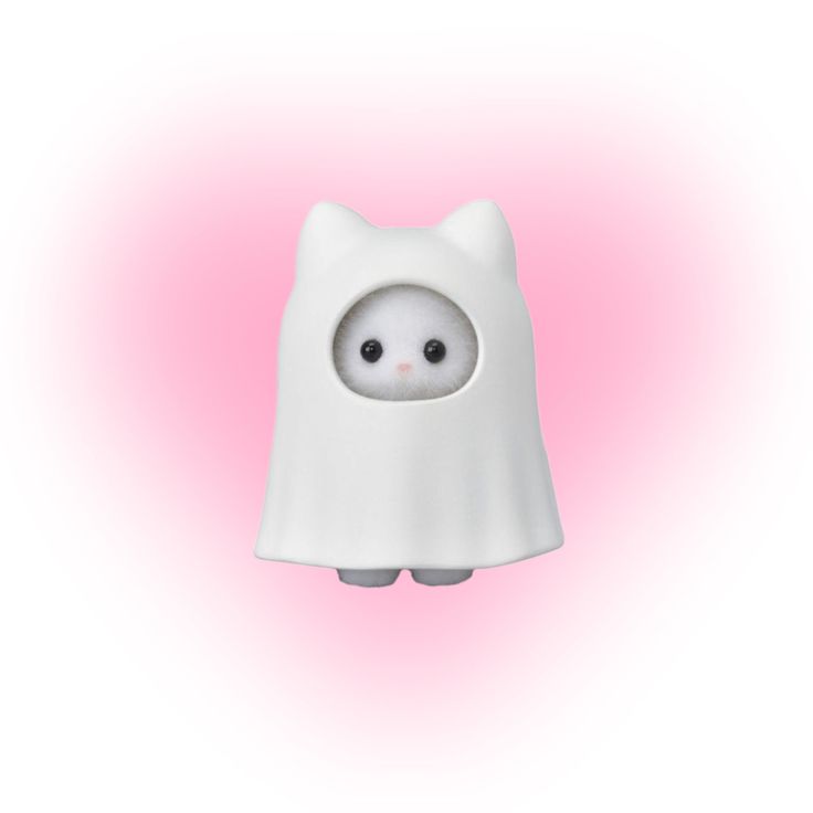 a white cat with a ghost costume on it's head and eyes, standing in front of a pink background