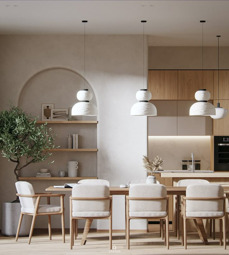 a dining room and kitchen area with white chairs