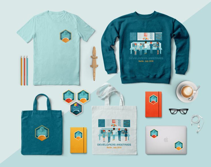 an assortment of clothing and accessories displayed on a blue background, including a sweater, notebook, pen, pencils, glasses, coffee cup, phone, mug, paper bag