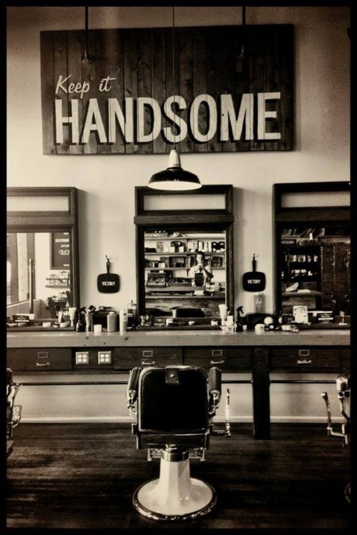 a black and white photo of a barbershop with the words keep it handsome