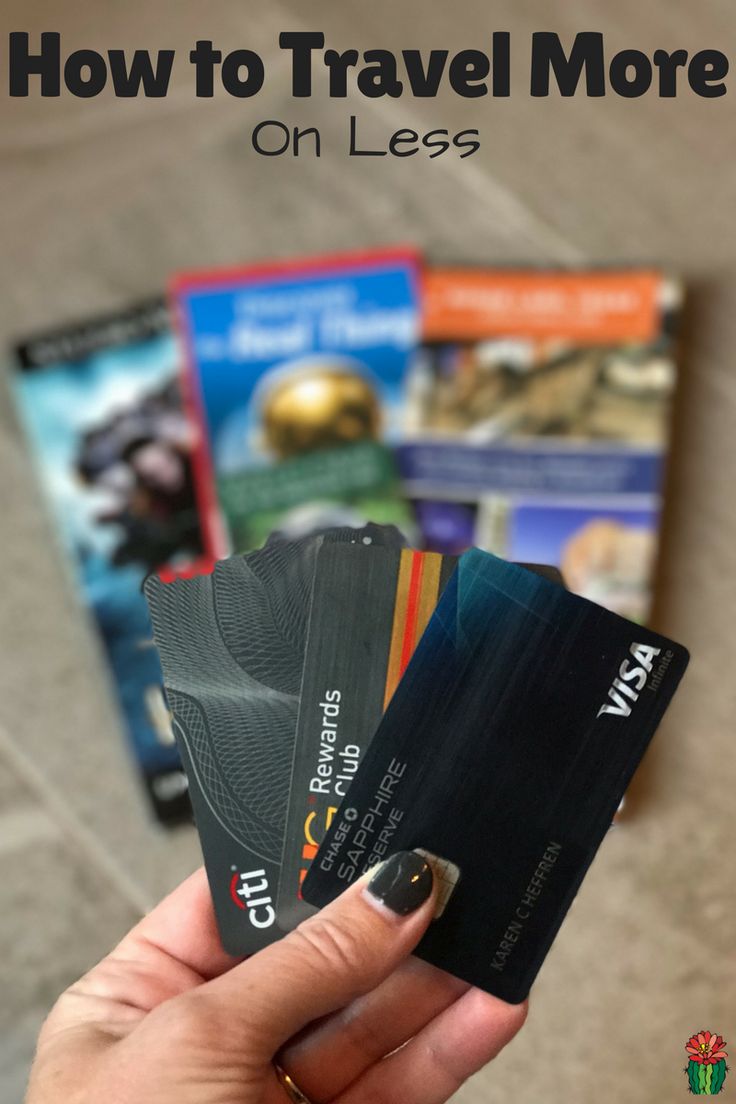 someone holding up their credit cards with the text how to travel more on less