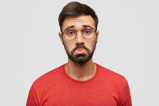 a man with glasses making a surprised face