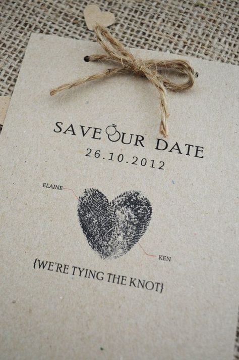 save - our - date tags are tied to burlap paper with twine