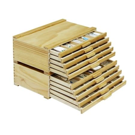 a stack of wooden boxes sitting next to each other on top of a white background