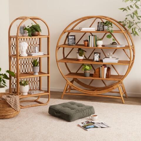 a living room filled with furniture next to a wall mounted planter and bookshelf