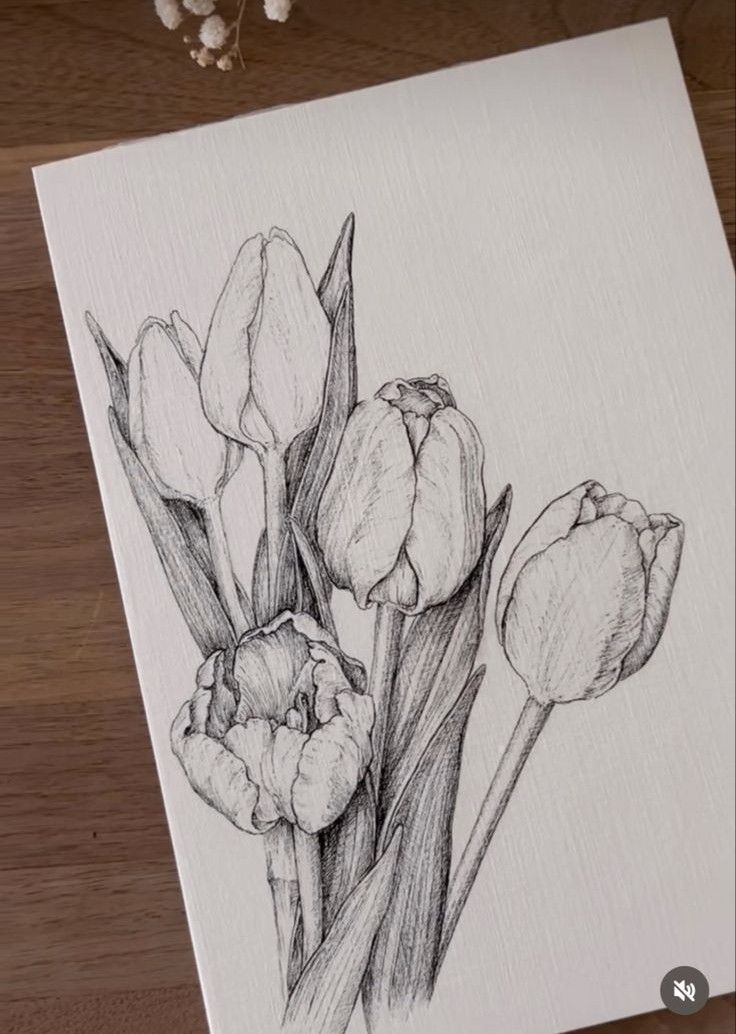 a drawing of three tulips sitting on top of a wooden table next to flowers