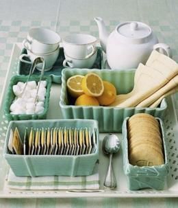 a tray filled with dishes and utensils on top of a table