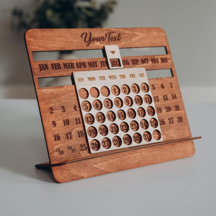 a wooden desk calendar with the date on it