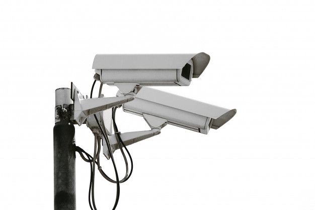 two security cameras attached to a metal pole