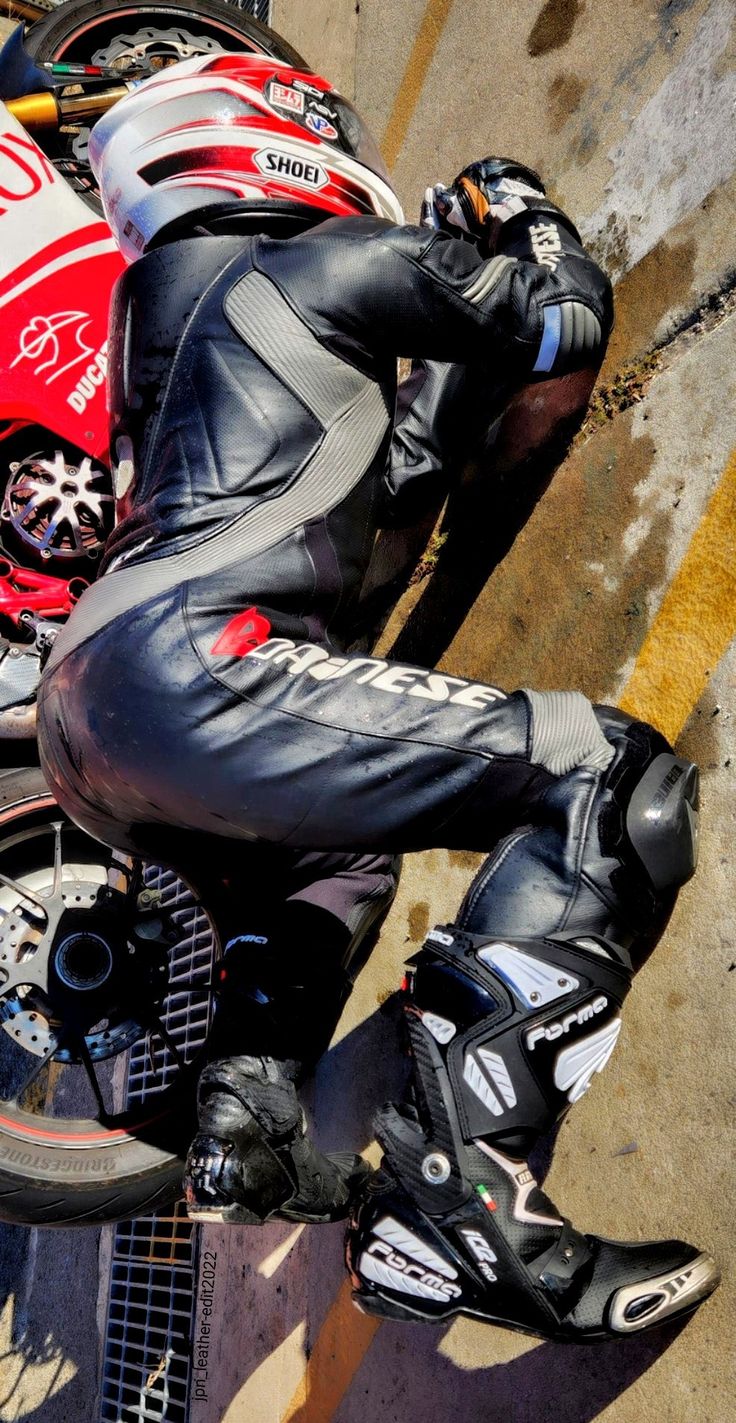 a person sitting on top of a motorcycle