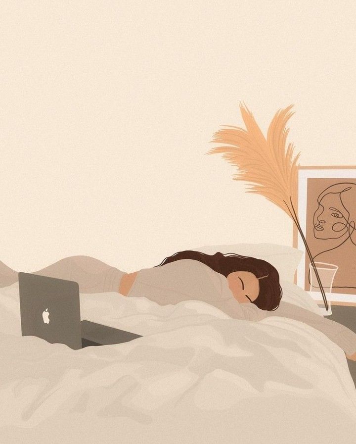 a woman laying in bed with her head on the pillow next to an apple laptop