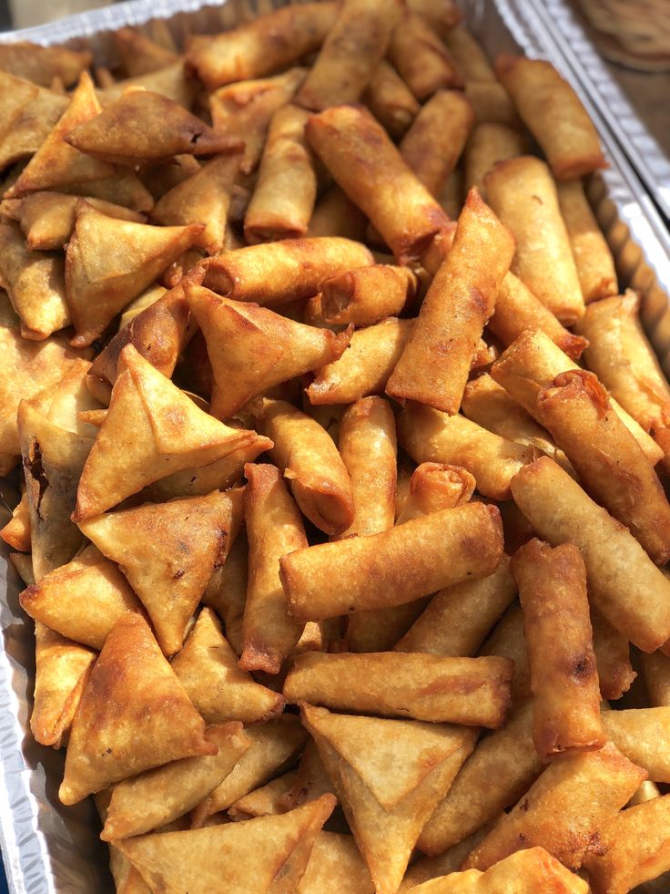 some food is sitting in a tray on the table and ready to be eaten,