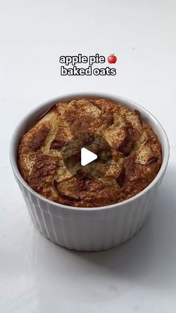 an apple pie baked in a white dish on a table with the caption apples baked cuts