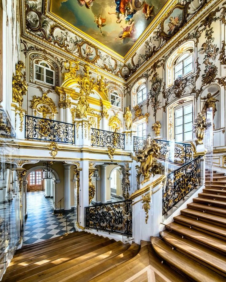 an ornately decorated staircase in the middle of a building