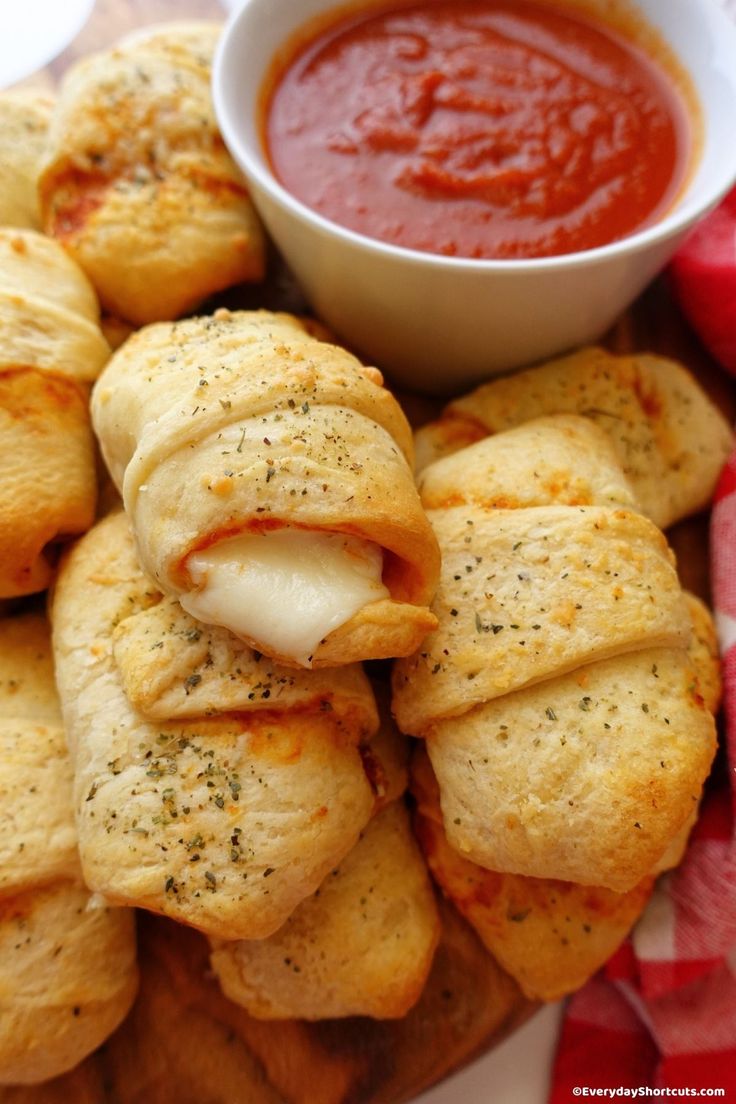 small pastries on a plate with dipping sauce