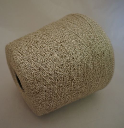 a spool of twine on a white surface