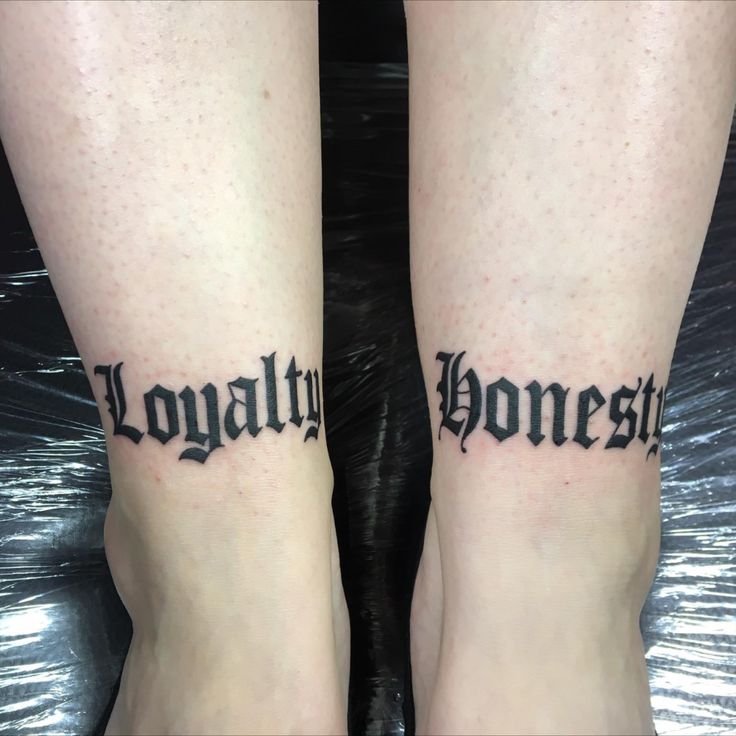 two people with tattoos on their legs that say,'tonight honesty '