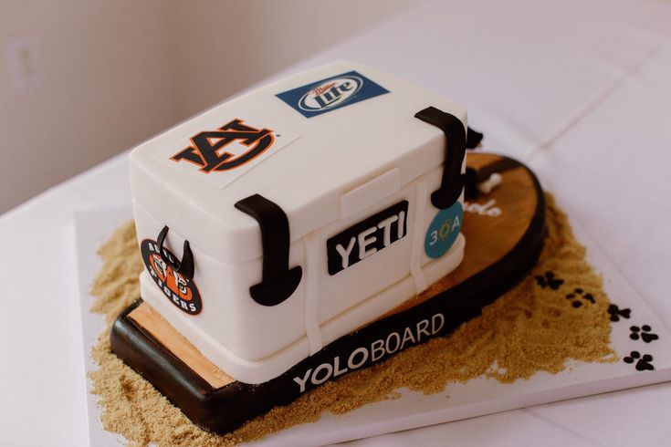 a cake made to look like an ice cream truck on top of sand and paw prints