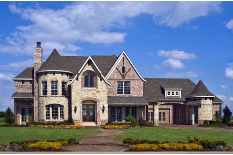 a large house with lots of windows and landscaping