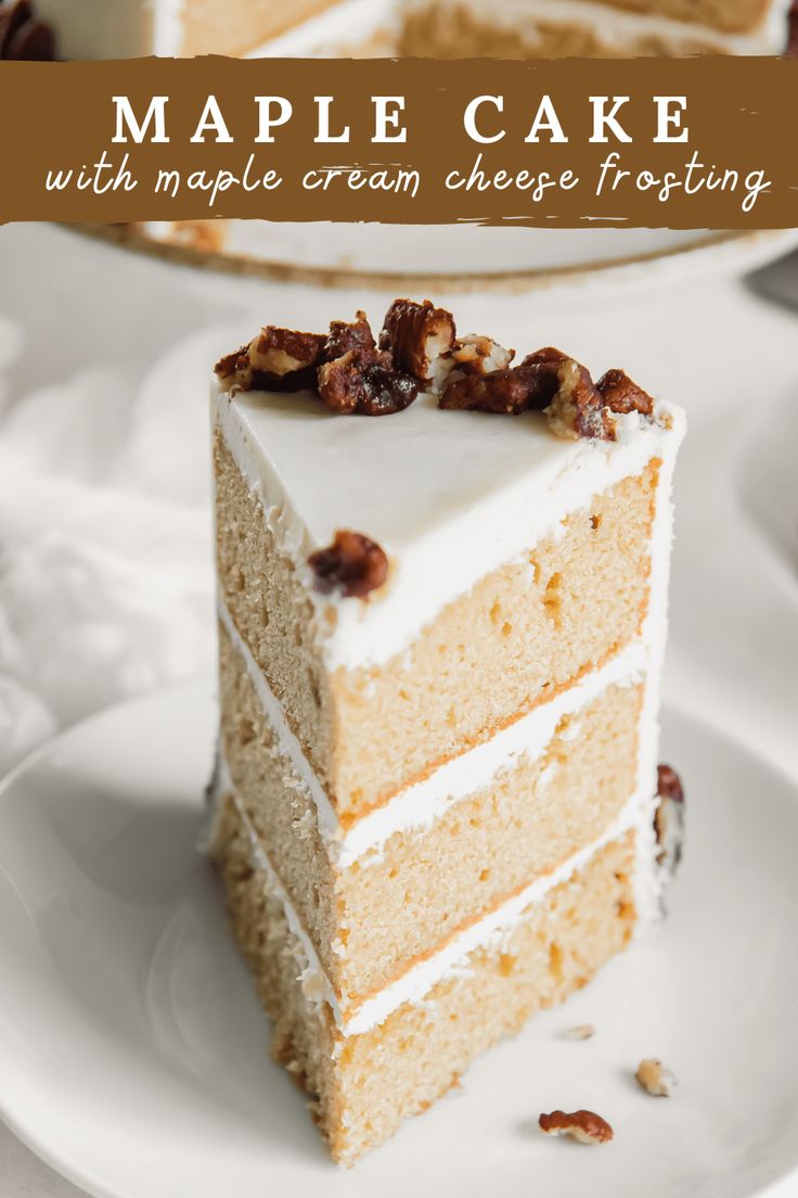 a slice of maple cake with maple cream cheese frosting is on a white plate