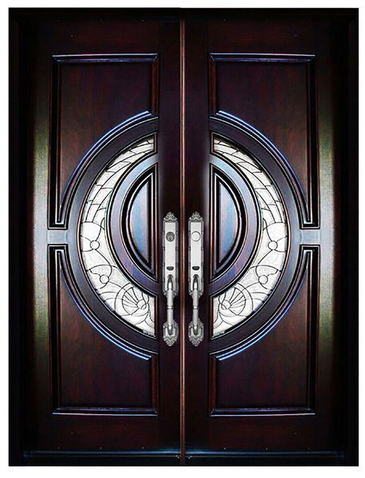 a close up of a wooden door with two glass panels and an oval design on the front