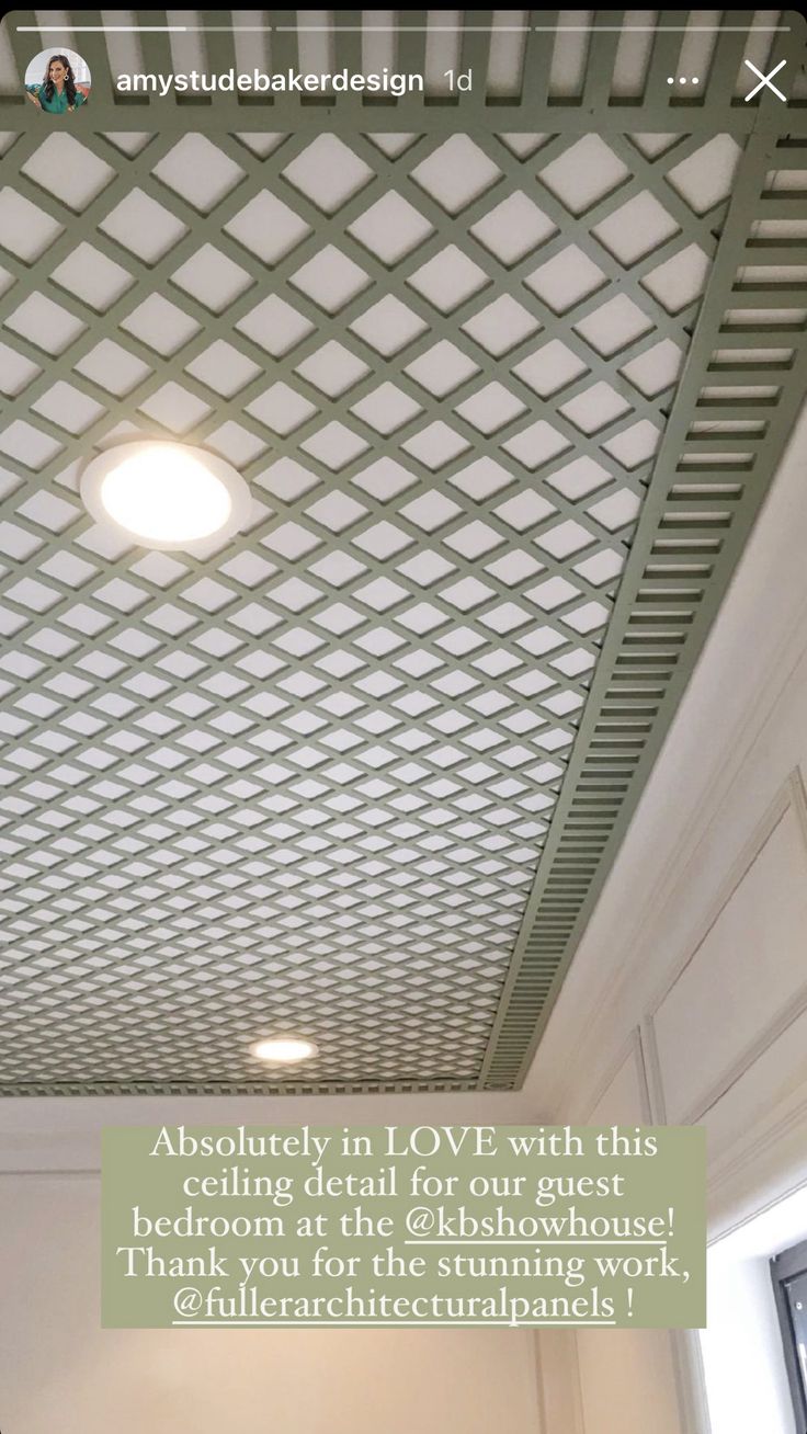 the ceiling in an office building has been decorated with white and green geometric designs on it