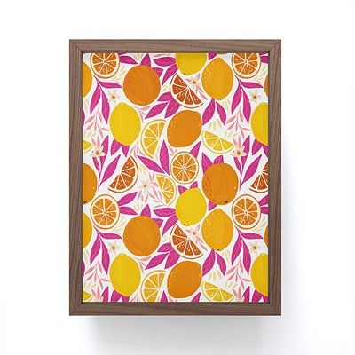 an orange and lemon print is mounted in a wooden frame