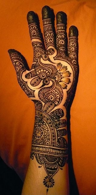 a person's hand with henna on it