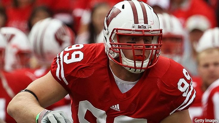 a football player wearing a red and white uniform