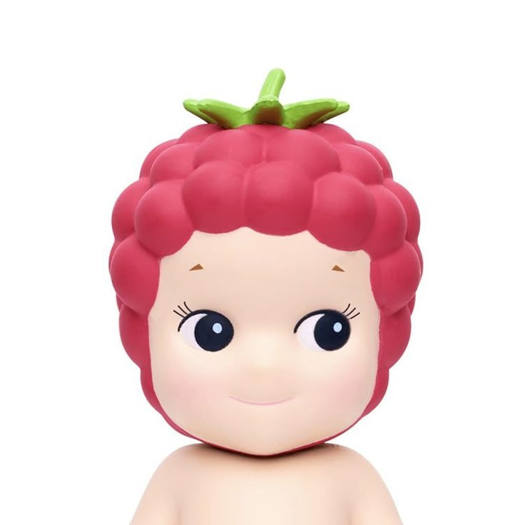 a small doll with red hair and big eyes