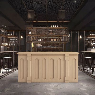 an empty bar with stools and tables in the back ground, lit by lights