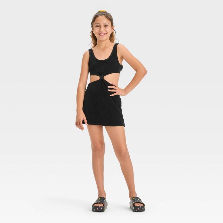 Your kiddo can layer their swimsuit while lounging on the beach or returning home from their swim session with this Solid Terry Cover-Up Dress from art class™. This sleeveless cover-up dress in a solid color features a center knot detail along with cutout sides and back for a stylish, breezy look. The cotton-blend terry fabric offers a cool and comfortable fit, while the pullover style allows for easy wear. Plus, the UPF 50+ rated finish offers added protection from UV rays. Welcome to art class Crochet Cover Up, Sewing Party, Terry Fabric, Body Poses, Art Dress, Black Body, Kids Outfits Girls, Swimsuit Cover Ups, Black Xs