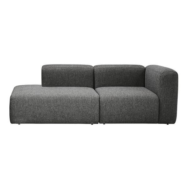 a gray couch sitting on top of a white floor