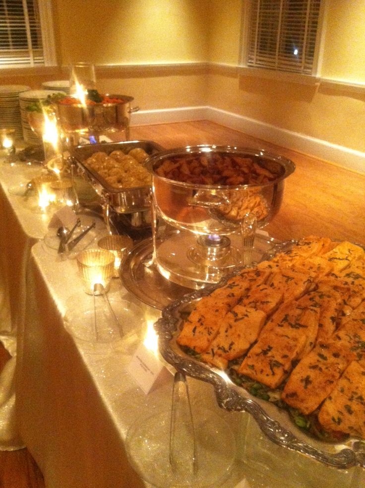 a buffet table filled with lots of food