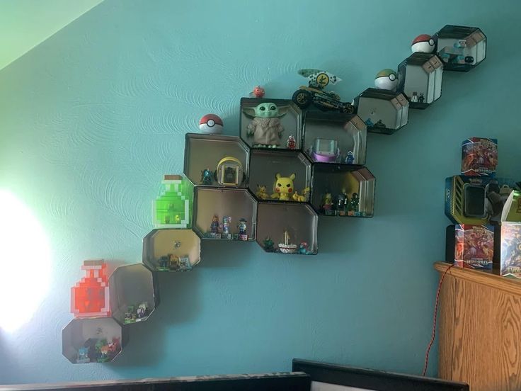 there are many shelves on the wall with video game items hanging from it's sides