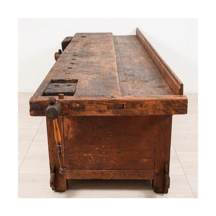 an old wooden table with two drawers