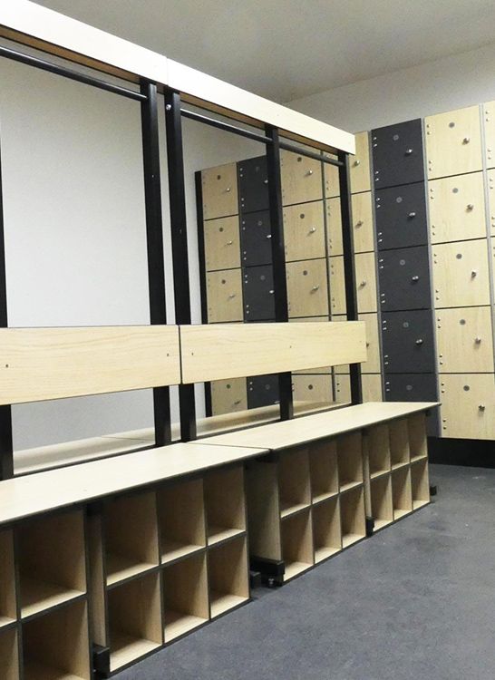 a room filled with lots of shelves and bins next to each other on the floor