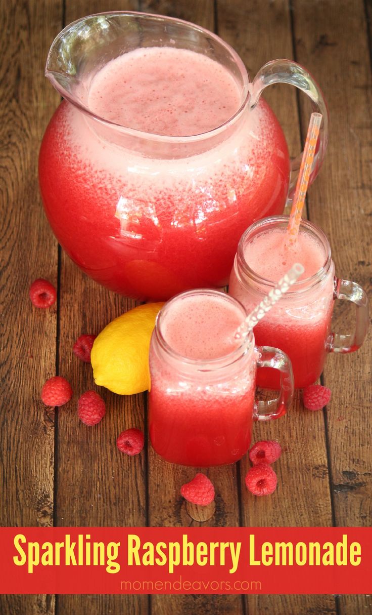 a pitcher of raspberry lemonade sitting next to two glasses filled with liquid