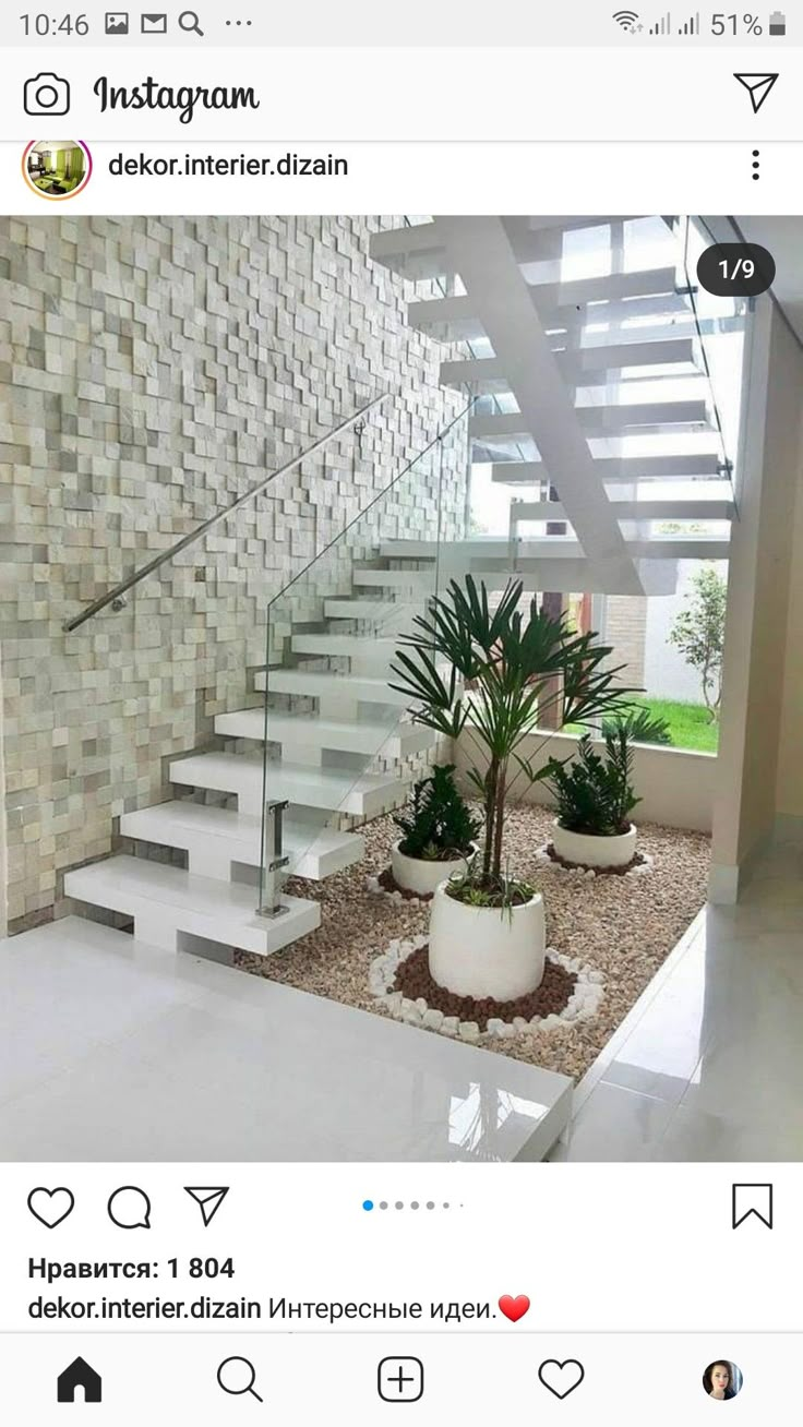 an instagram photo of a house with stairs and potted plants