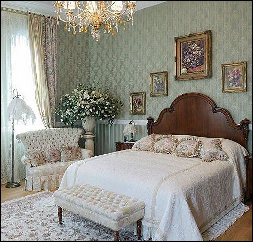 a large bed sitting in the middle of a bedroom