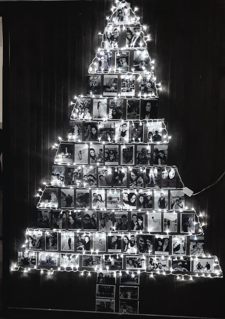 a christmas tree made out of photos and lights