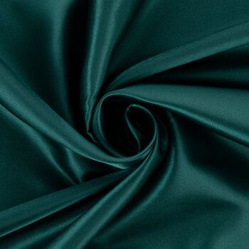 a close up view of a green satin fabric